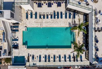 arial view of a swimming pool in the middle of a building at Altis Grand Central, Tampa, FL